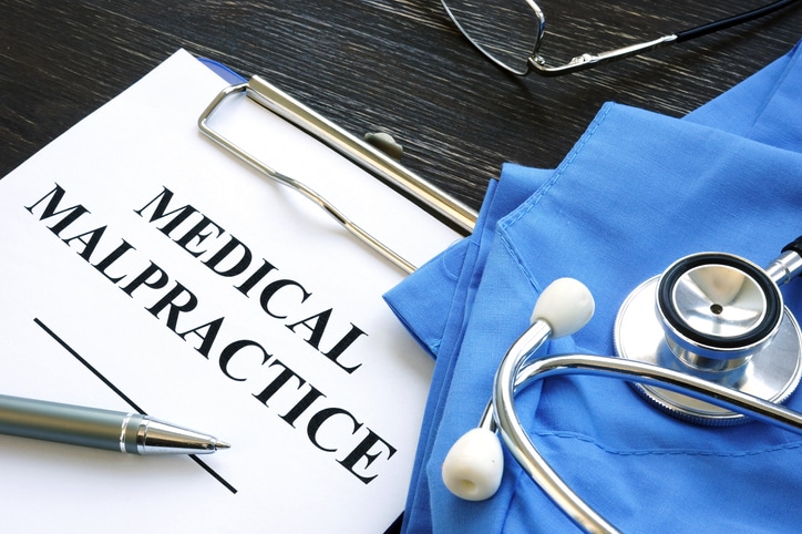 Medical malpractice. Medical suit, stethoscope and papers.